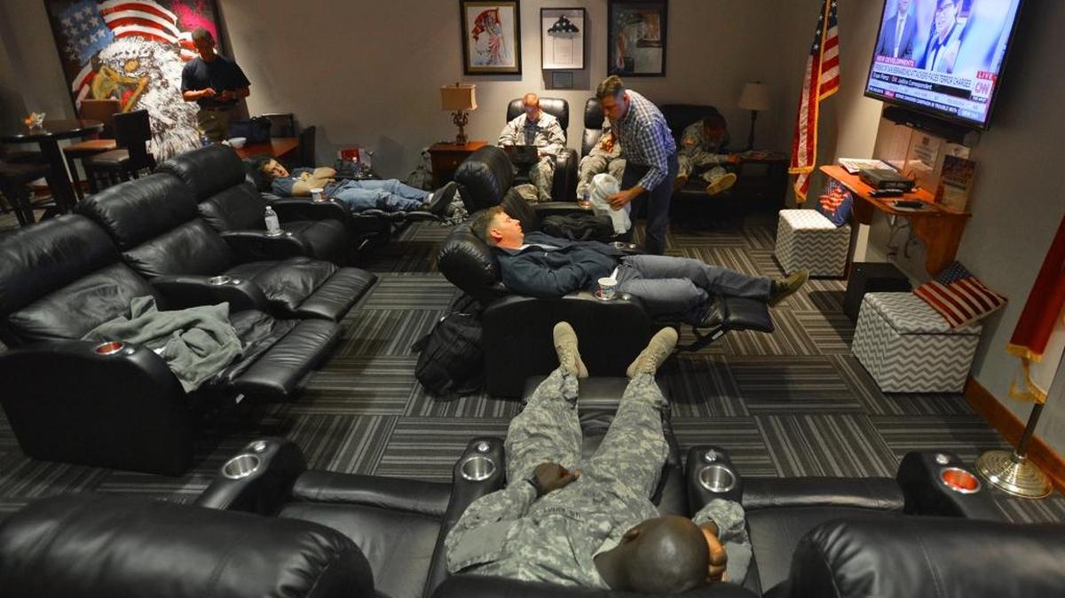 Soldiers relax at the USO of North Carolina Charlotte Center at Charlotte Douglas International Airport in December 2015.