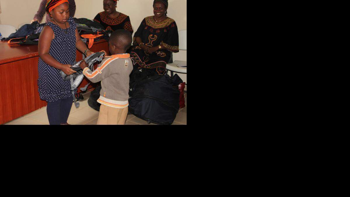 
Mongai Fankam distributes backpacks in Cameroon.
