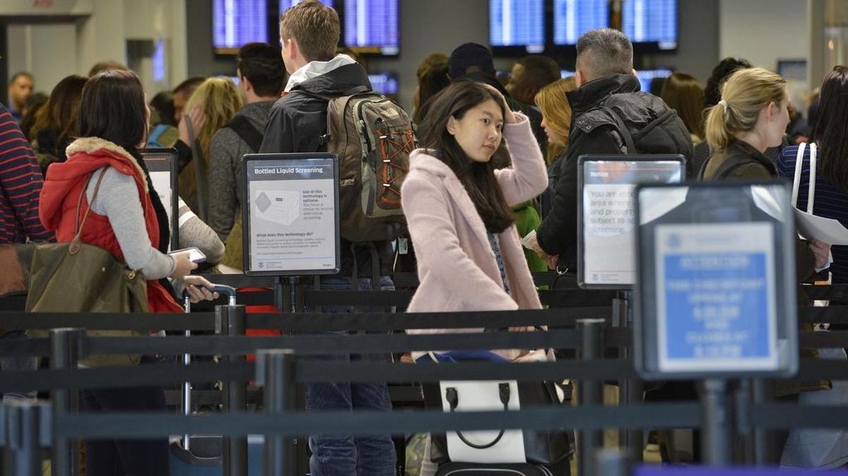 Charlotte Douglas International Airport was busy but running smoothly Wednesday morning on what is expected to be the busiest travel day of the year