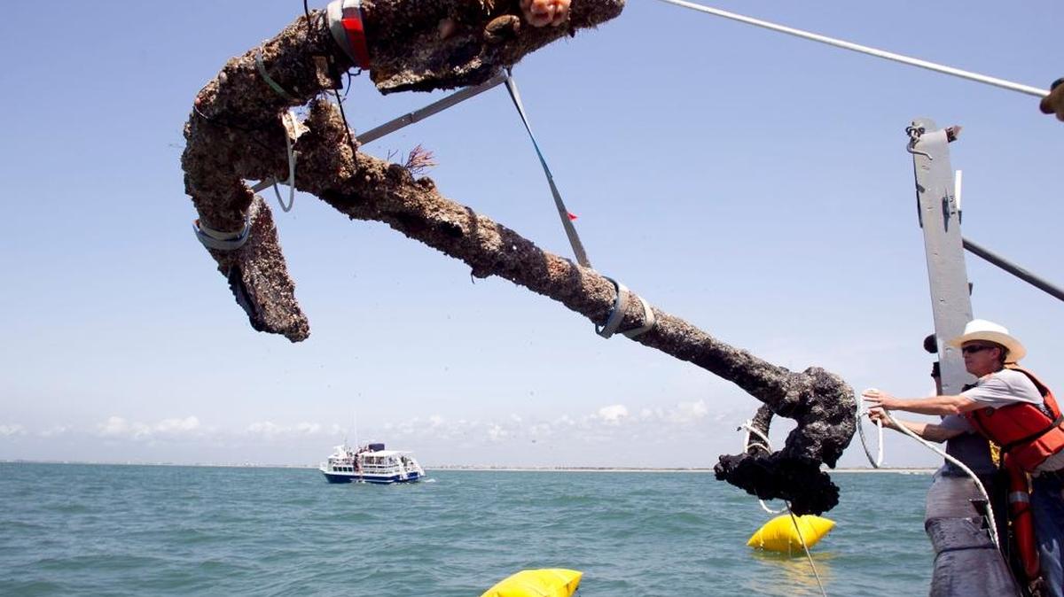 A 3,000-pound anchor from what is believed to be the wreck of the pirate Blackbeard’s flagship, the Queen Anne’s Revenge, is recovered from the ocean in Beaufort Inlet in 2011.