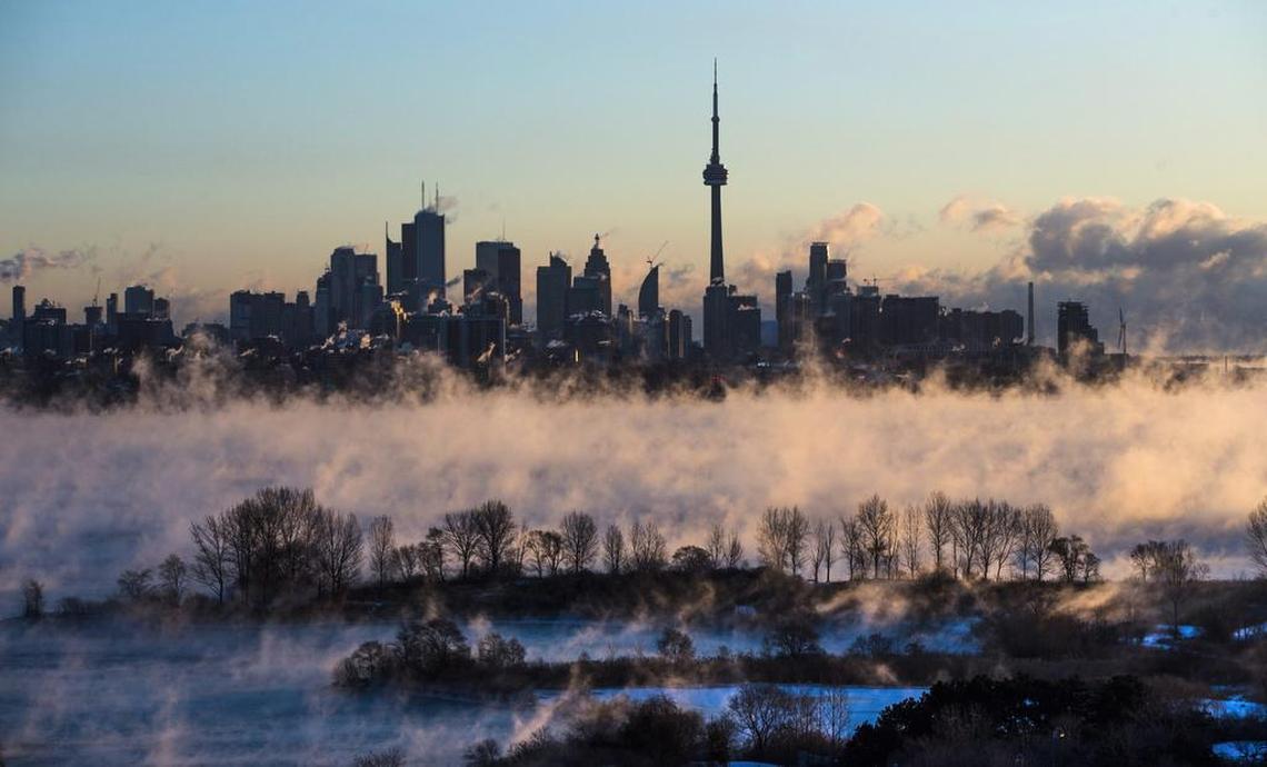 Mist rises from Lake Ontario in front of the Toronto skyline during extreme cold weather on Saturday, Feb. 13, 2016.