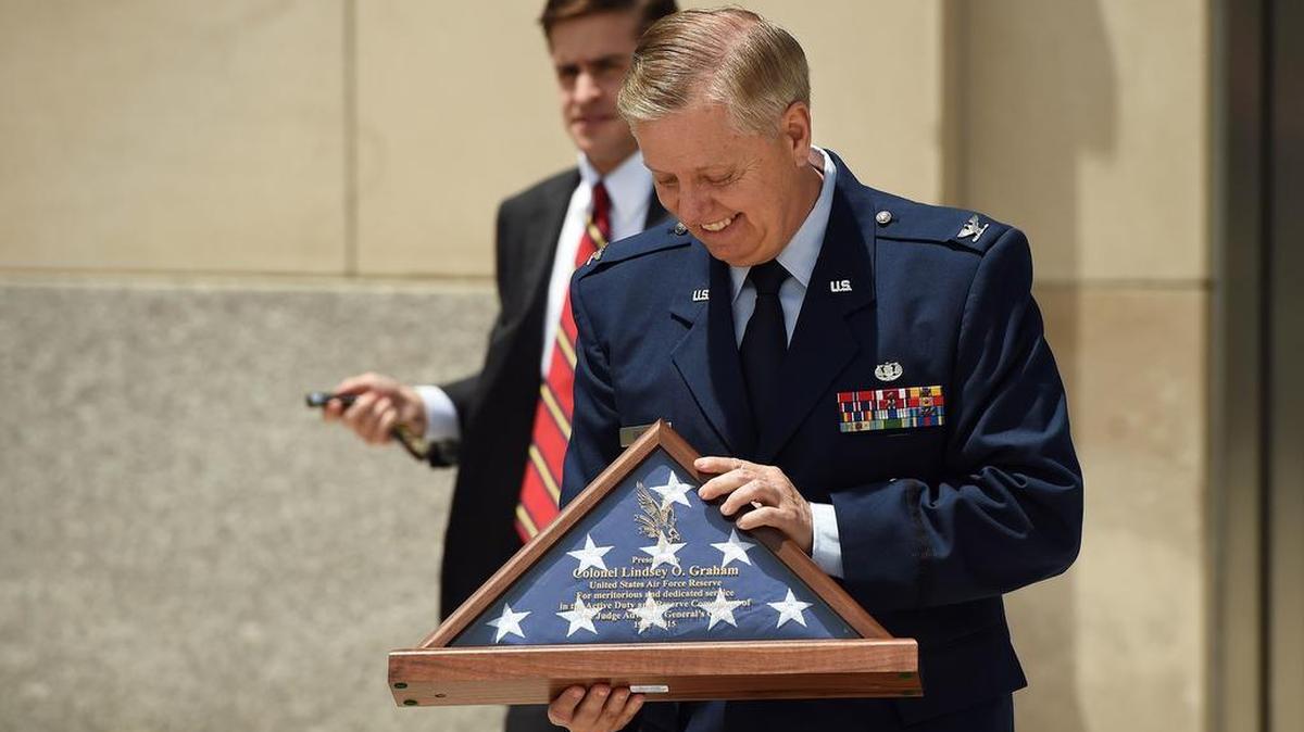 
Sen. Lindsey Graham, R-S.C., leaves his military retirement ceremony at the National Guard Memorial Museum on June 24. 
