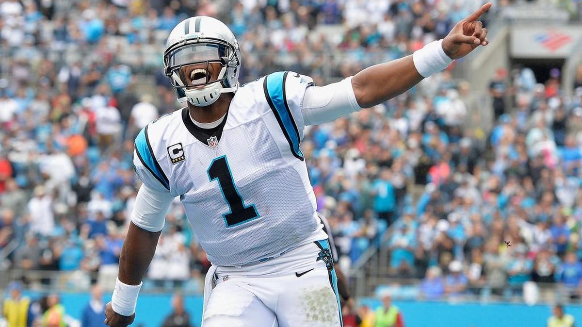 
Cam Newton #1 of the Carolina Panthers reacts after throwing for a touchdown against the New Orleans Saints during their game at Bank of America Stadium on September 27, 2015 in Charlotte, North Carolina. (Photo by Grant Halverson/Getty Images)
