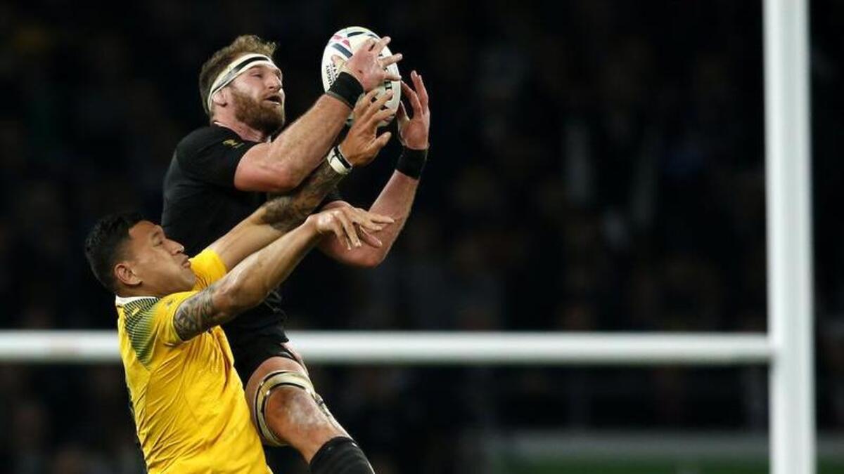 New Zealand’s Kieran Read leaps to take the ball from Australia’s Israel Folau during the Rugby World Cup final between New Zealand and Australia at Twickenham Stadium.