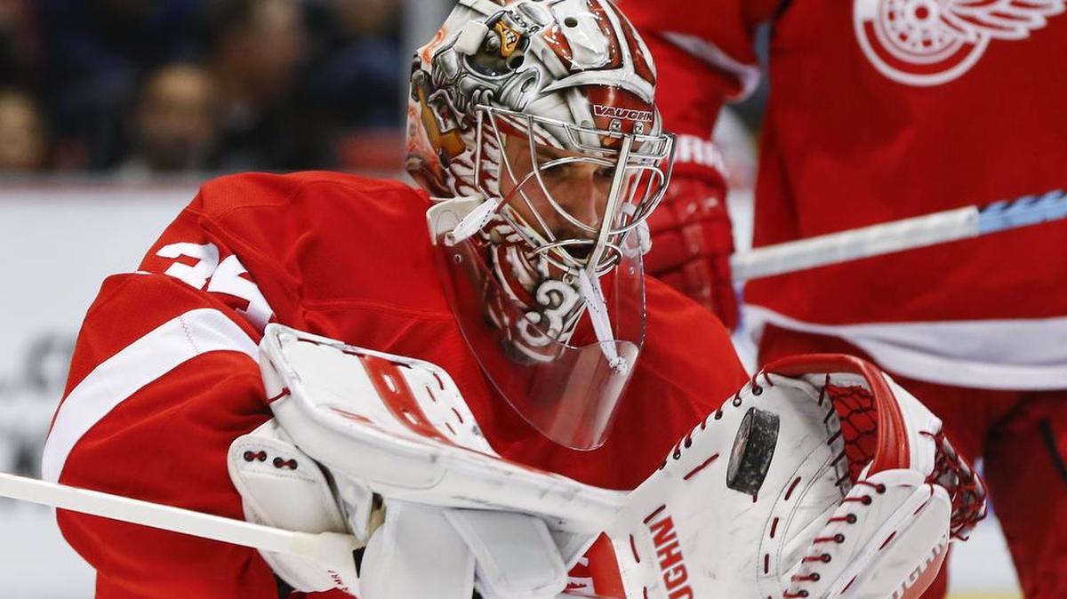 Detroit Red Wings goalie Petr Mrazek (34) stops a Montreal Canadiens shot in the first period of an NHL hockey game on March 24, 2016, in Detroit.