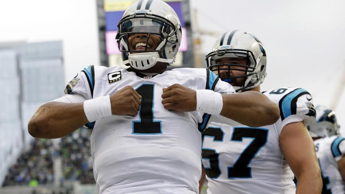 
Carolina Panthers quarterback Cam Newton (1) reacts after he rushed for a touchdown in the first half of an NFL football game against the Seattle Seahawks, Sunday, Oct. 18, 2015, in Seattle. (AP Photo/Elaine Thompson)
