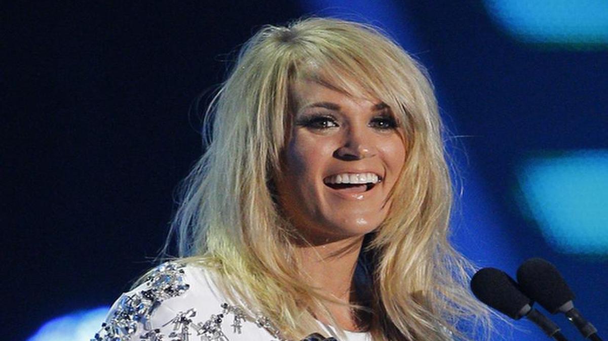 
Carrie Underwood accepts the award for collaborative video of the year for "Somethiní Bad" at the CMT Music Awards at Bridgestone Arena on Wednesday, June 10, 2015, in Nashville, Tenn. (Photo by Wade Payne/Invision/AP)

