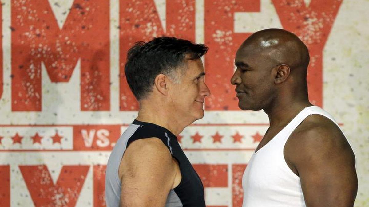 
Former Republican presidential candidate Mitt Romney, left, and five-time heavyweight boxing champion Evander Holyfield face each other during an official weigh-in Thursday, May 14, 2015, in Holladay, Utah. Romney and Holyfield are set to square off at a charity fight on Friday, May 15, in Salt Lake City. The black-tie event will raise money for the Utah-based organization CharityVision, which helps doctors in developing countries perform surgeries to restore vision in people with curable blindness. (AP Photo/Rick Bowmer)
