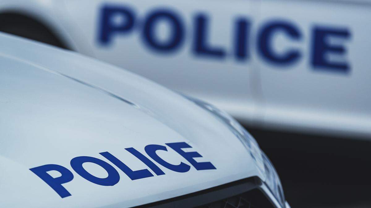 Police cars in parking lot.