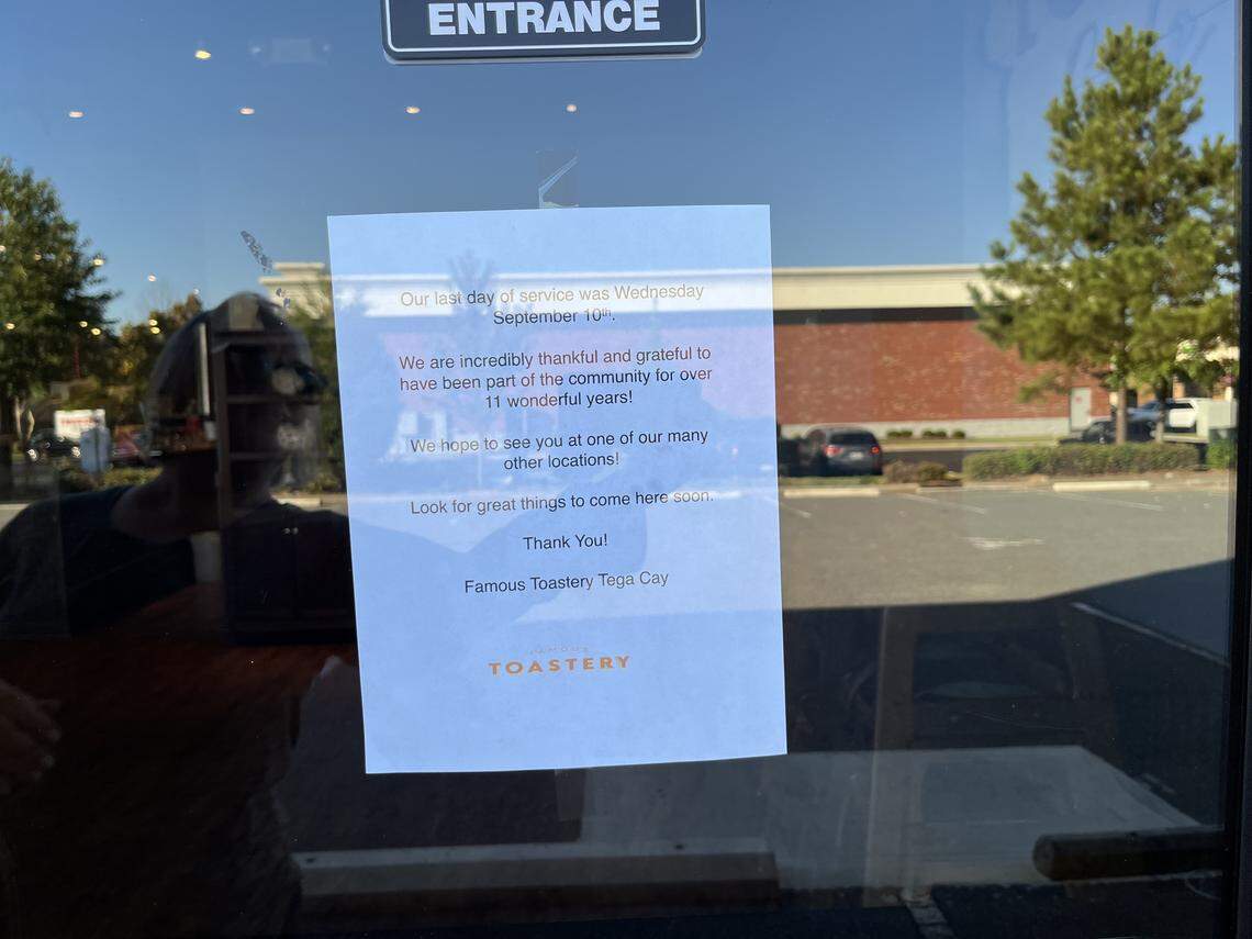 A white paper sign taped to the glass door of a restaurant, announcing its closure. The sign, titled “Our last day of service was Wednesday September 10th,” thanks the community for 11 years of support and directs patrons to other locations.