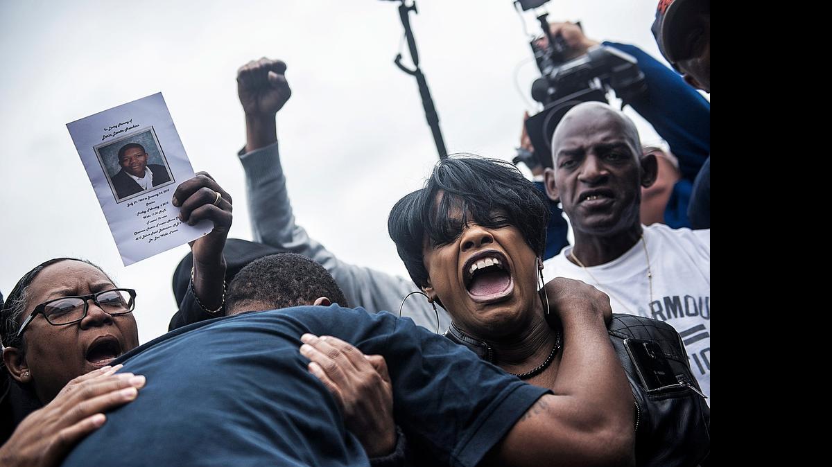 
The Rev. Pamela Coleman, right, celebrates charges filed against police officers in the death of Freddie Gray, who died after sustaining a spinal cord injury while in police custody, in Baltimore, May 1, 2015. Baltimore prosecutors, in an unexpected announcement, said Friday that they had probable cause to file homicide, manslaughter and misconduct charges against police officers in Gray’s death. 
