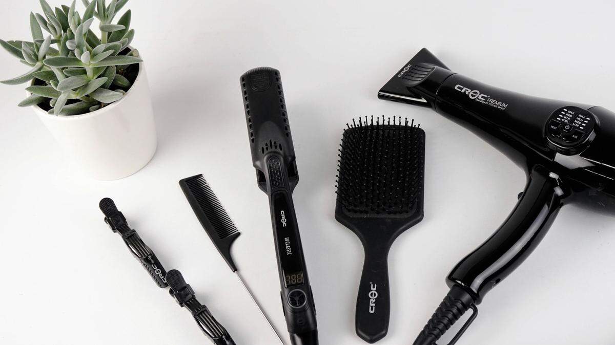 A Tennessee hairstylist faces charges including false imprisonment after she refused to let a client leave, police said.