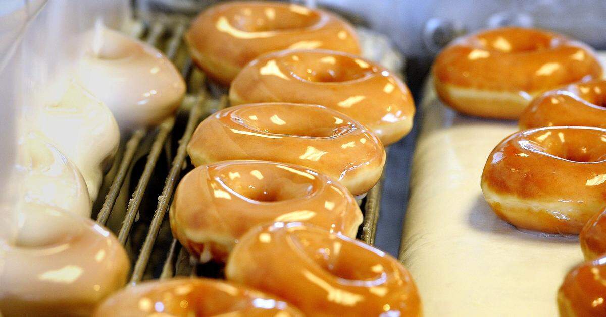 Donuts are on the assembly line as the Krispy Kreme at 1901 Gallatin Pike in Madison is holding it grand re-opening July 1, 2014.