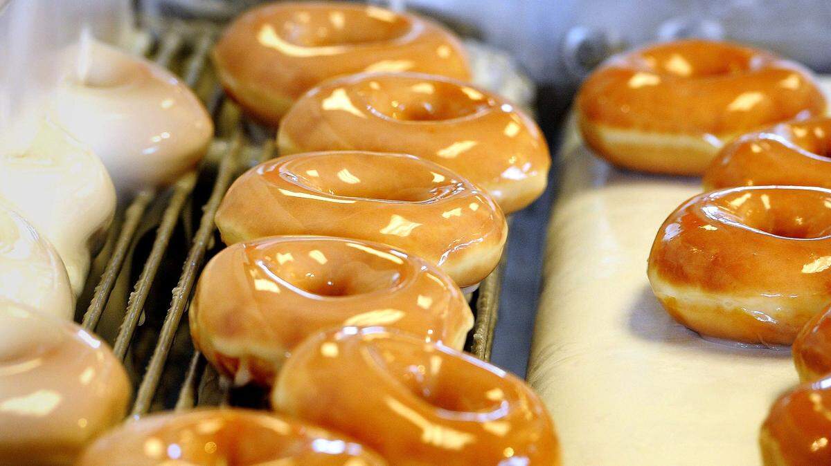 Donuts are on the assembly line as the Krispy Kreme at 1901 Gallatin Pike in Madison is holding it grand re-opening July 1, 2014.