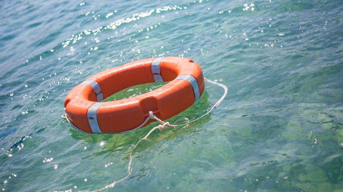 Life buoy on transparent sea