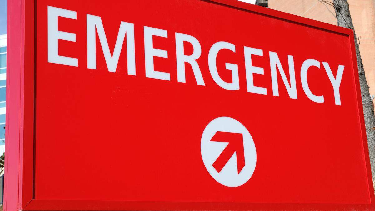 A tire shop employee died after being pinned underneath an RV in Newnan, Georgia, officials said.