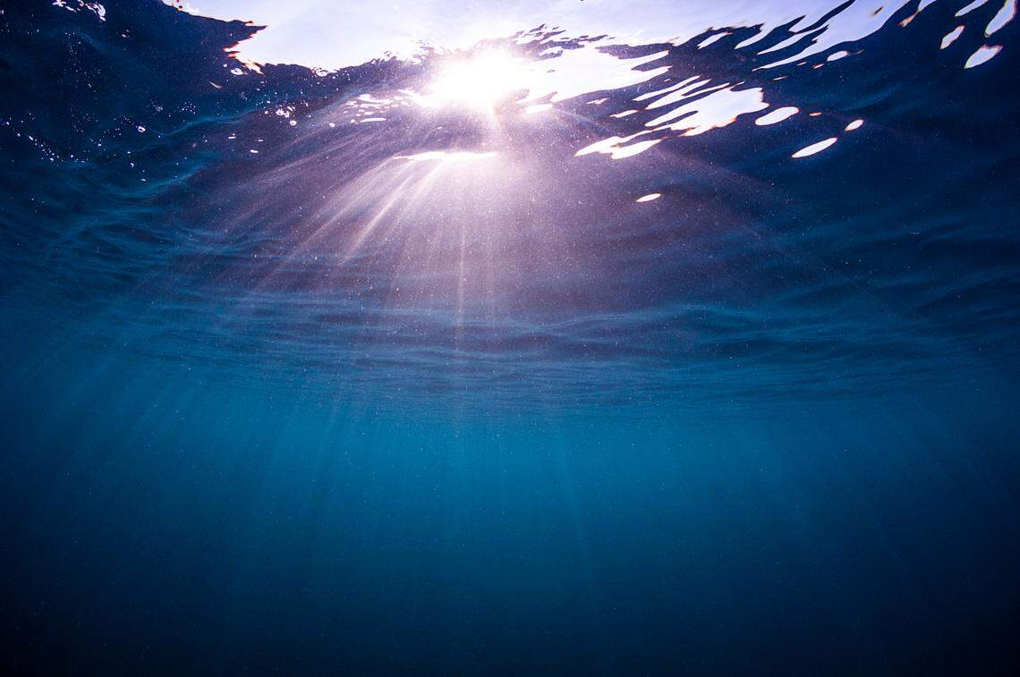 Below sea level, light shines under water