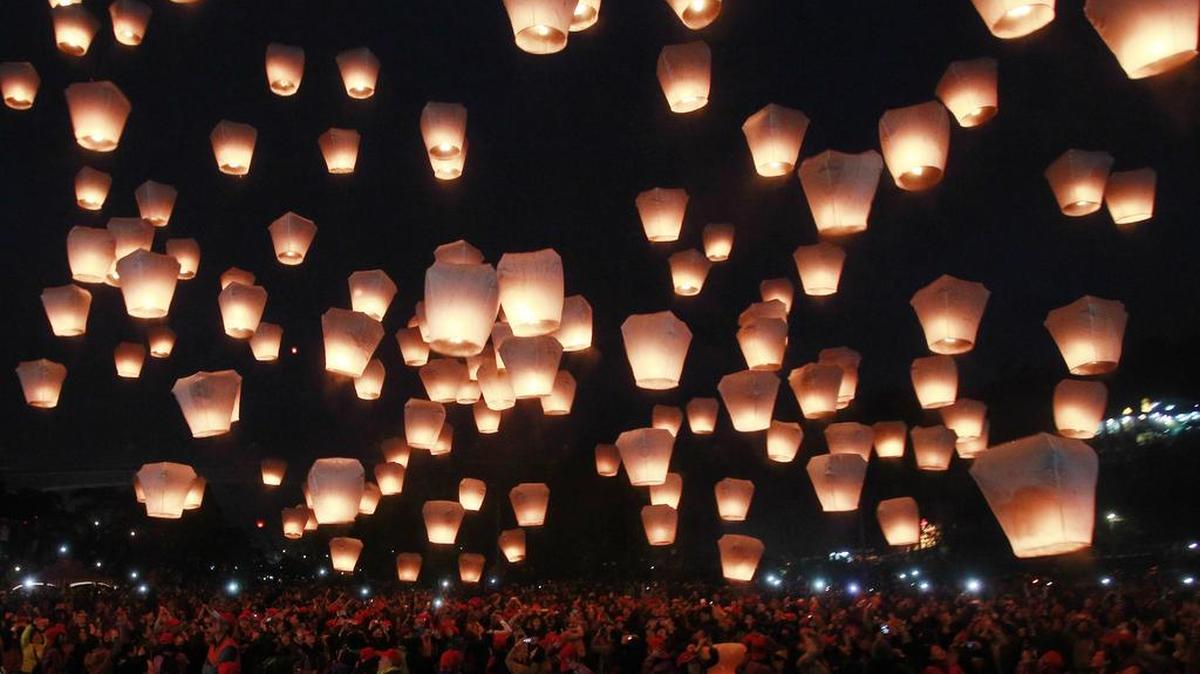 Hundreds of people release lanterns into the air in hopes of good fortune and prosperity at the traditional lantern festival during the Chinese New Year in the Pingxi district of New Taipei City, Taiwan, Monday, Feb. 22, 2016. The lantern festival starts 15 days after the Chinese Lunar New Year and falls on Feb. 22, this year. (AP Photo/Chiang Ying-ying)