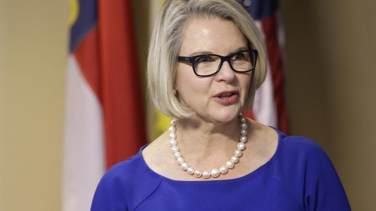 FILE - In this Friday, Oct. 23, 2015, file photo, Margaret Spellings, president of the North Carolina public university system, makes comments after being elected by the University of North Carolina Board of Governors in Chapel Hill, N.C. University of North Carolina officials have until Monday to comply with federal civil rights laws on transgender bathroom use, the U.S. Justice Department said.