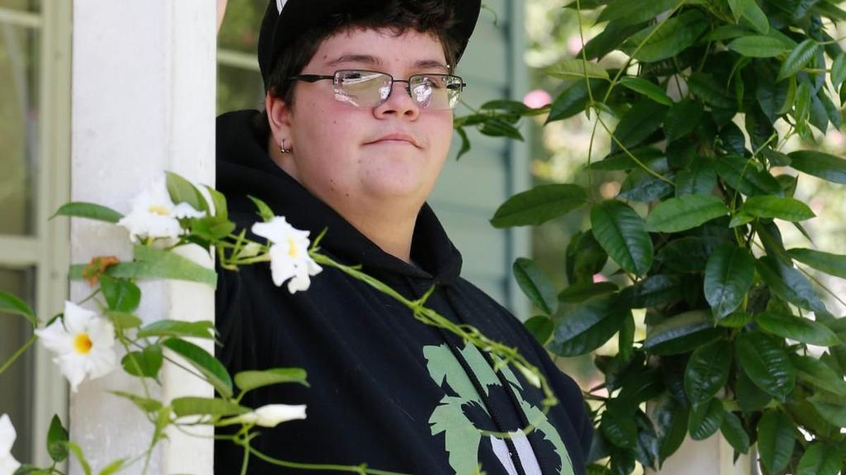 An Aug. 25, 2015, file photo shows Gavin Grimm on his front porch at his home in Gloucester, Virginia. A U.S. appeals court overturned a policy barring a transgender student from using the boys’ restrooms at his Virginia high school.