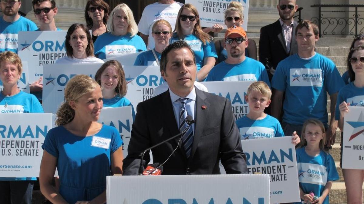 FILE - In this July 28, 2014, file photo, Greg Orman, right, an independent candidate for the U.S. Senate in Kansas, discusses his campaign during a news conference, as his wife, Sybil, watches to his left in Topeka, Kan. Orman got 43 percent of the vote against three-term incumbent Republican Pat Roberts. Running that campaign was Jim Jonas, a Charlotte native and scion of one of the area’s most respected Republican families.