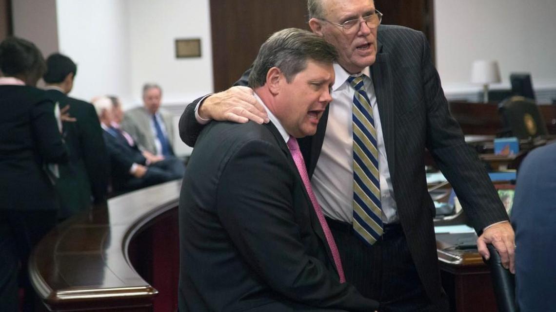 
Senators Mike Woodard (D) and Jerry Tillman (R) sing a rendition of "Long Back Veil" as the clock approaches midnight on the senate floor during the final hours of the long legislative session Tuesday at the State Legislative Building.
