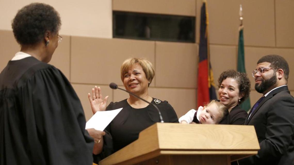 Vi Lyles is sworn in as mayor of Charlotte by Superior Court Judge Yvonne Mims Evans while her family watches on Monday.