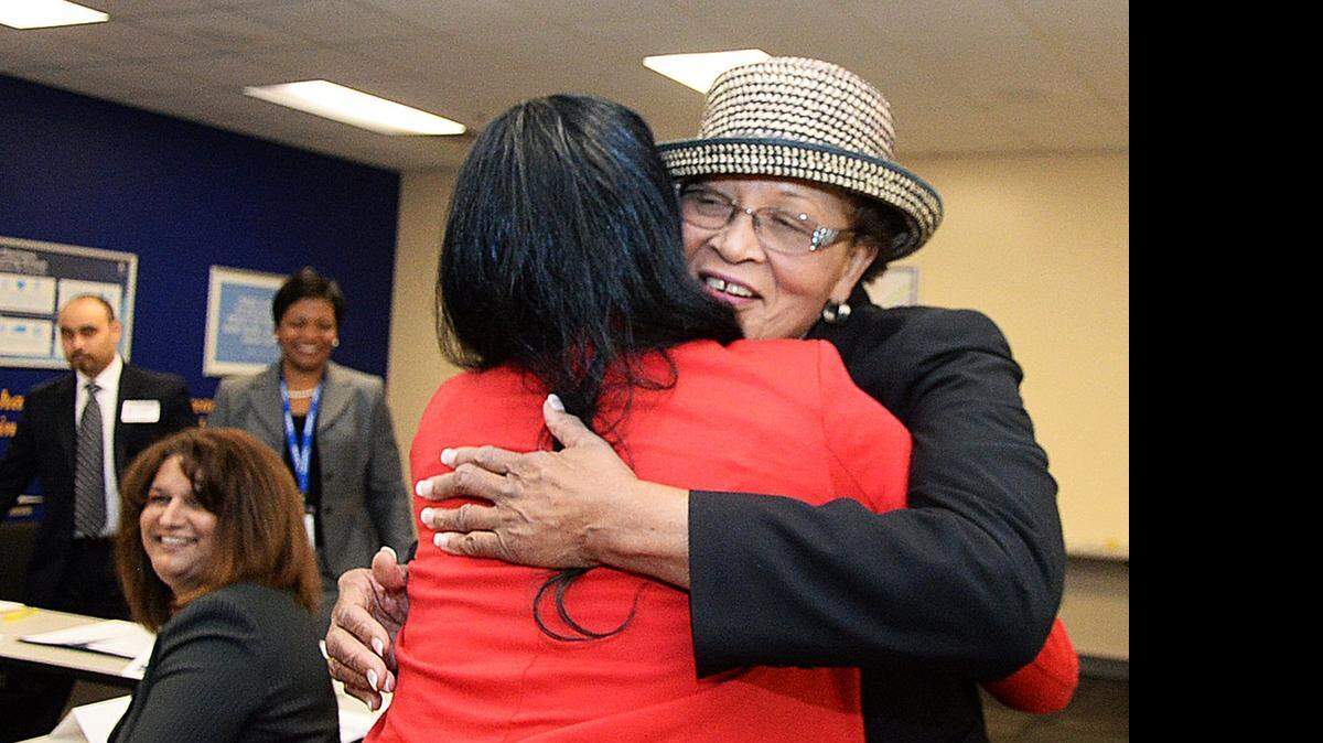 
Goodwill client Da-Shauna Fulwiley, left, hugs U.S Rep. Alma Adams, D-NC, after talking with her during a visit to Goodwill Industries of the Southern Piedmont in Charlotte. Adams spoke with several Goodwill clients to understand their struggles to find jobs. Adams, of Greensboro, represents the 12th Congressional District, which includes parts of Charlotte. 

