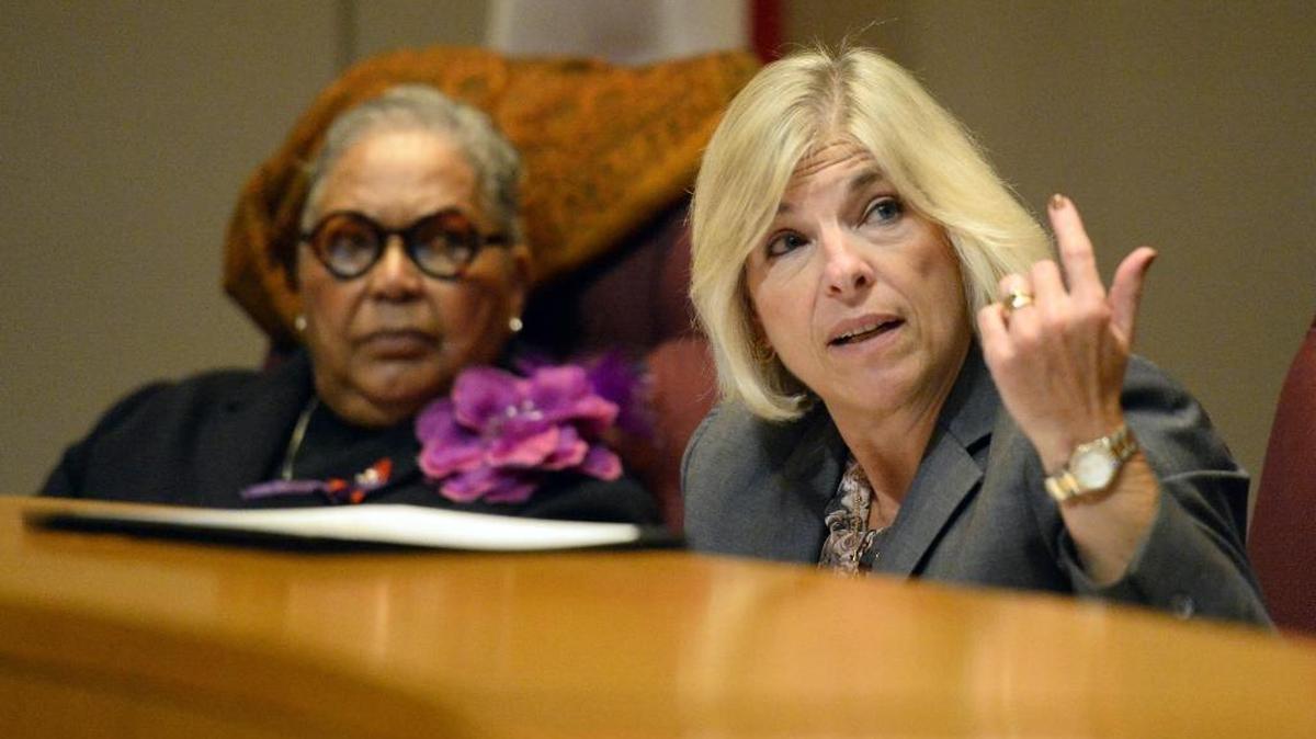 Mecklenburg County commissioners approved a nearly $2 billion budget that includes a tax hike for most property owners that was proposed by County Manager Dena Diorio (right).