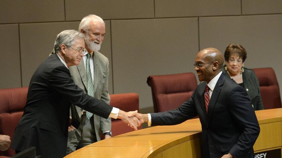 Charlotte’s new city manager, Marcus Jones, shakes hands with councilmen Ed Driggs and John Autry after Jones was formally announced as the city manager. The Charlotte City Council introduced its new city manager, Marcus Jones of Norfolk, on Wednesday, Oct. 19, 2016.