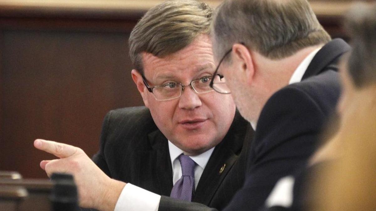 Tim Moore, Speaker of the House, left, confers with Phil Berger, President Pro Tempore, in the Senate chambers during a special session of the N.C. General Assembly at the Legislative Building in Raleigh, N.C., Friday, Dec. 16, 2016.