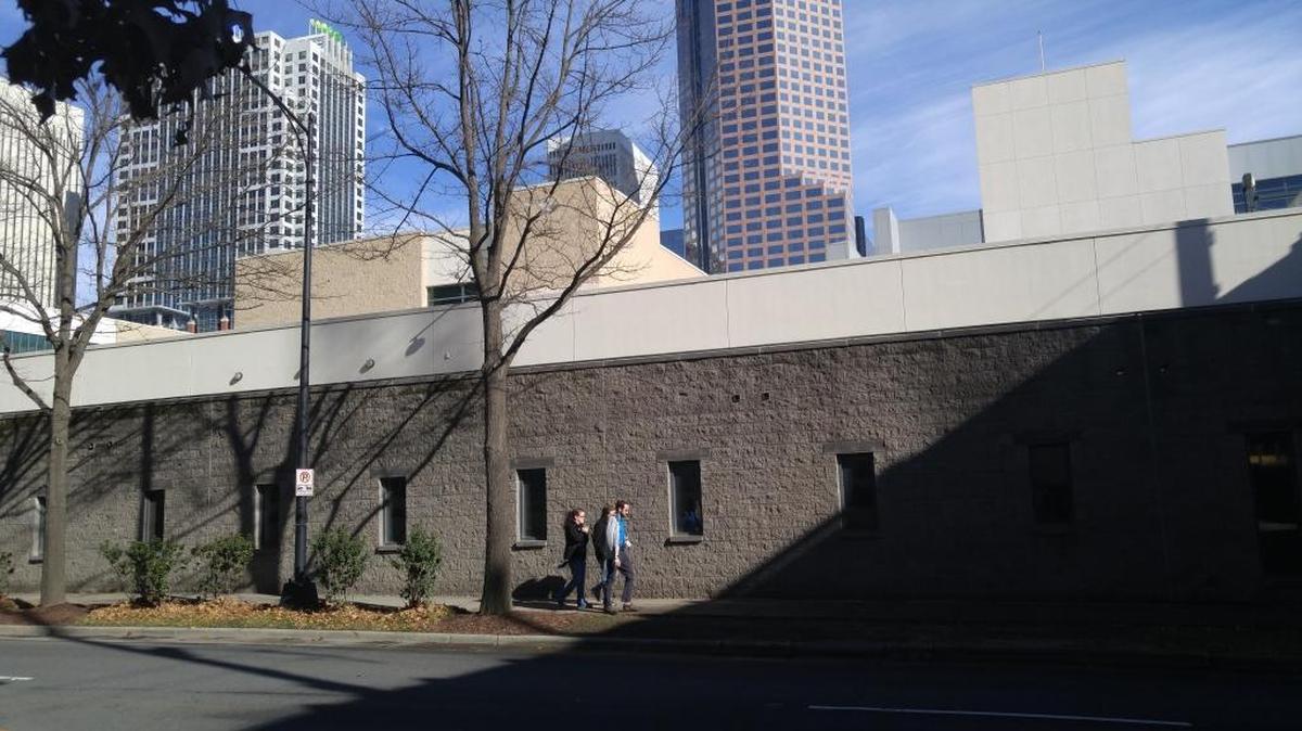 Much of the Charlotte Convention Center facing Stonewall Street is a wall that hides a loading dock for trucks.