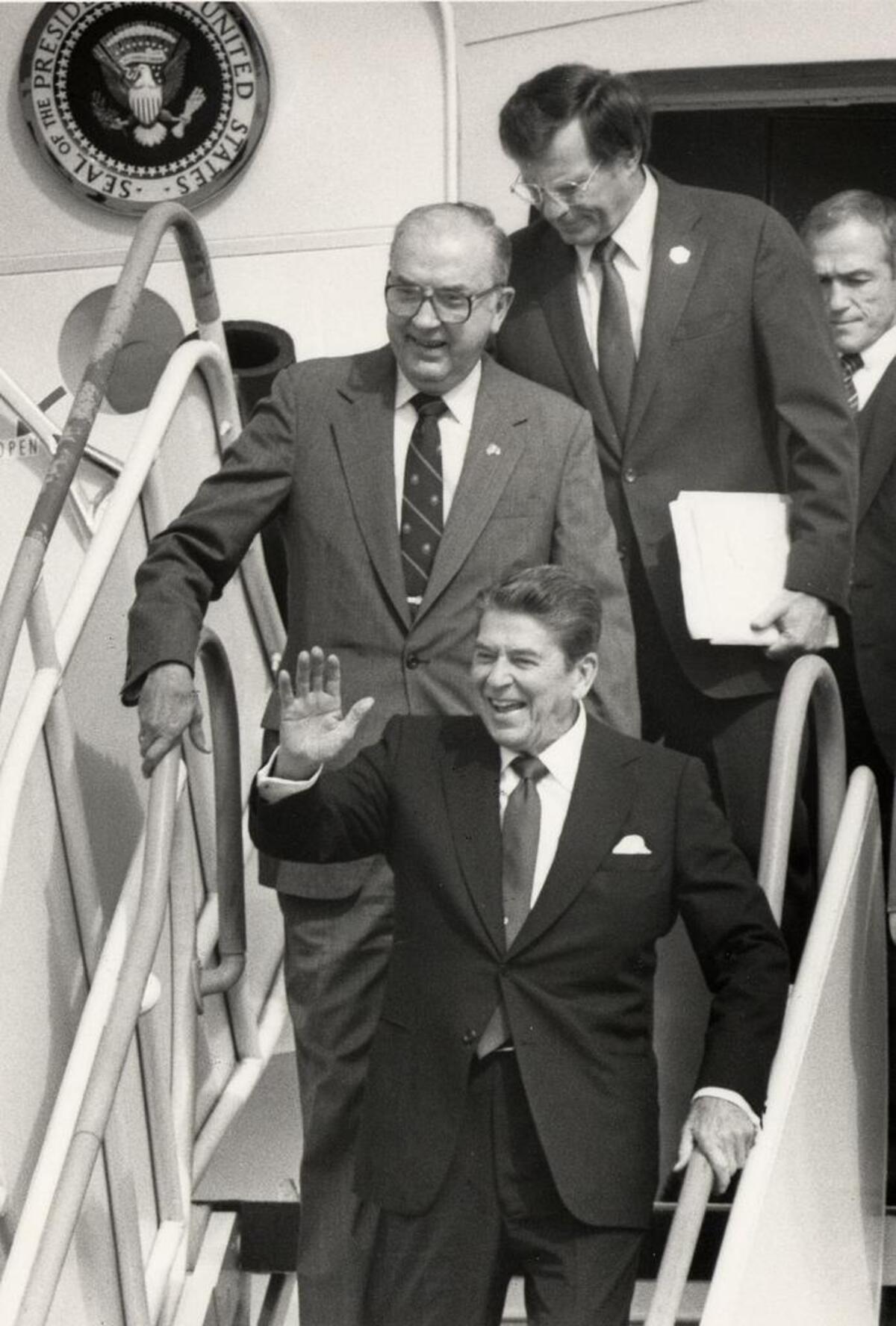 In this 1984 file photo, Ronald Reagan visits Charlotte. Sen. Jesse Helms and Charlotte Mayor Eddie Knox are behind him.
