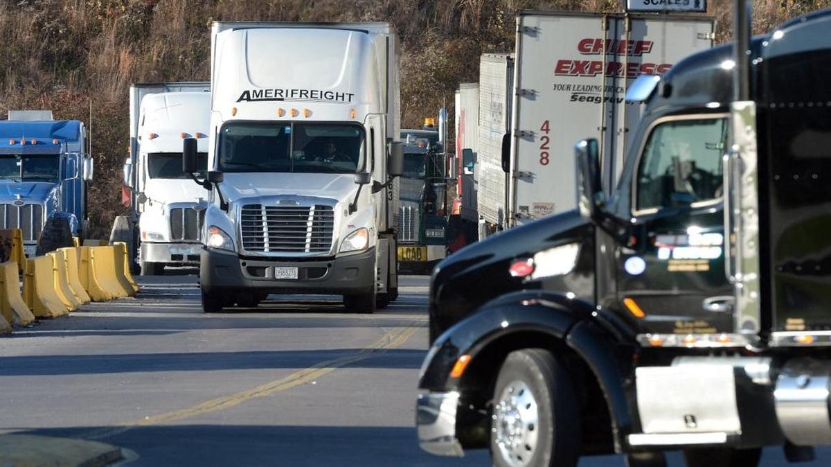 Truck traffic into a truck stop at the intersection of Hwy 89 and I-77 is crowded with truckers in Surry County in northwestern North Carolina. NC Highway Patrol troopers write the most tickets for roadside napping to interstate truckers in Surry County, and truckers complain there aren't enough areas for them to take breaks when on the road.