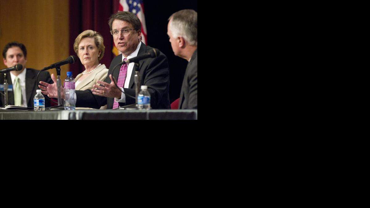 
Gov. Pat McCrory, second from right, speaks at a panel discussion with state municipal leaders at an event put on Wednesday by the N.C. League of Municipalities at the N.C. Museum of History in Raleigh. Listening are, from left, Paul Meyer, executive director of the N.C. League of Municipalities; Susan Kluttz, N.C. secretary of the Department of Cultural Resources; and Tony Tata, secretary of the N. C. Department of Transportation.
