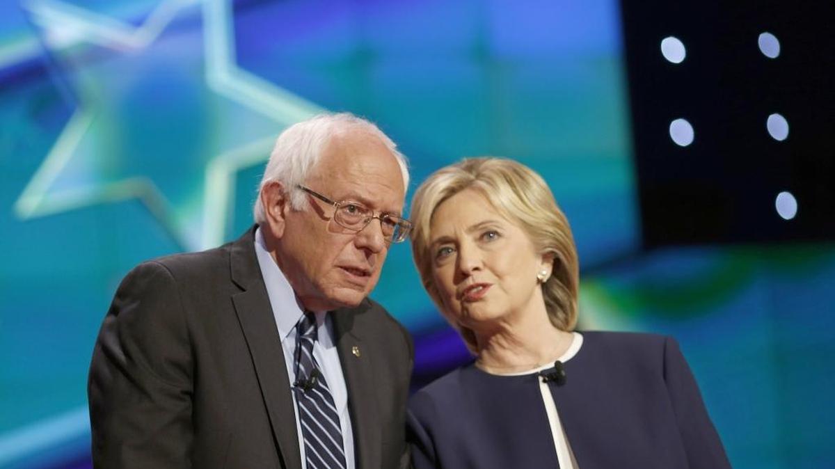 Sen. Bernie Sanders, an independent from Vermont, and Hillary Clinton, former Secretary of State, speak with each other on stage shortly before the start of the first Democratic presidential debate at the Wynn Las Vegas resort and casino in Las Vegas, Nevada, U.S. on Tuesday. Clinton turned in a bracing, formidable, approachable, nearly flawless performance that was in almost every respect stronger than any she delivered in 2007-2008.