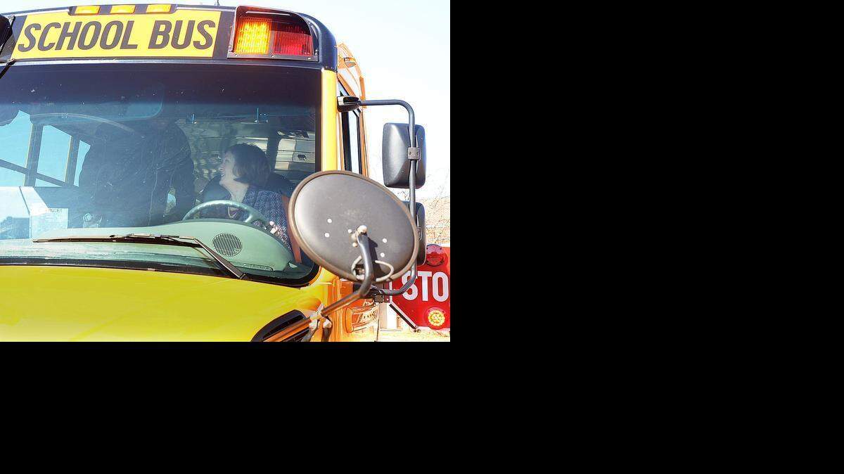 
Superintendent Ann Clark got into the bus driverâs seat briefly to operate the stop arm and flashing lights with the help of bus driver Theodore Taylor during a visit by Clark to Beverly Woods Elementary School Wednesday as part of National Love the Bus and Bus Driver Appreciation Week. 
