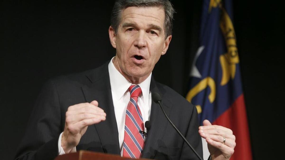 Governor-elect Roy Cooper speaks during a press conference at PNC Arena in Raleigh, N.C to talk about the N.C. Senate voting down the repeal of HB2, Wednesday, Dec. 21, 2016.