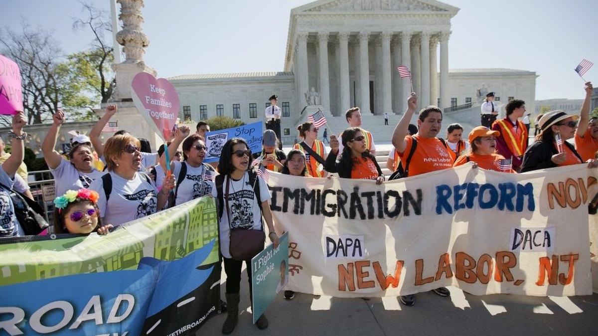 Supporters of fair immigration reform gather in front of the Supreme Court in Washington, Monday, April 18, 2016. The Supreme Court is taking up an important dispute over immigration that could affect millions of people who are living in the country illegally. The Obama administration is asking the justices in arguments today to allow it to put in place two programs that could shield roughly 4 million people from deportation and make them eligible to work in the United States.