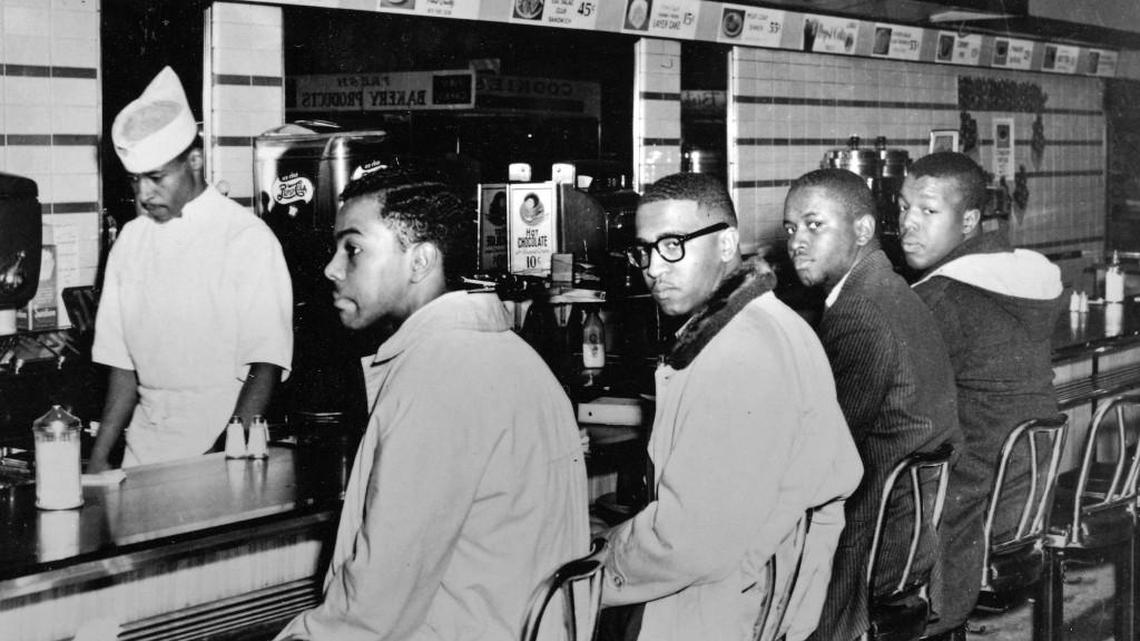 Clarence Henderson, far right, on the second day of the Woolworth’s sit-in. He’s with, from left, Joe McNeil, Franklin McCain and Billy Smith.