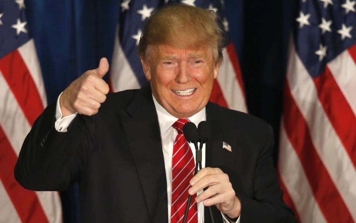 Republican presidential candidate Donald Trump gives a thumbs-up as he speaks at campaign stop in Portland, Maine.