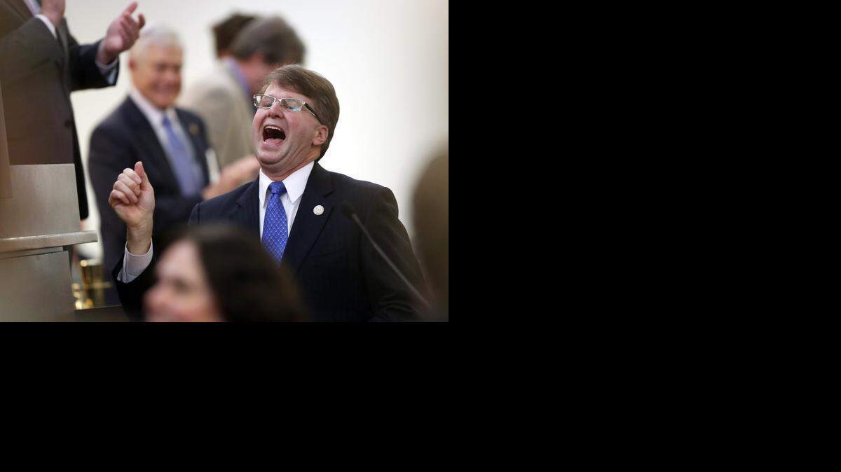 
N.C. Chief Justice Mark Martin enters the House chambers before delivering a State of the Judiciary address before the N.C. General Assembly on Wednesday at the Legislative Building in Raleigh. 
