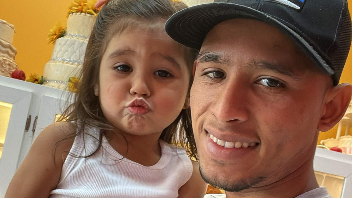 Julio Zambrano Perez with his daughter. He worked and lived in Davidson before being sent to an El Salvador prison.