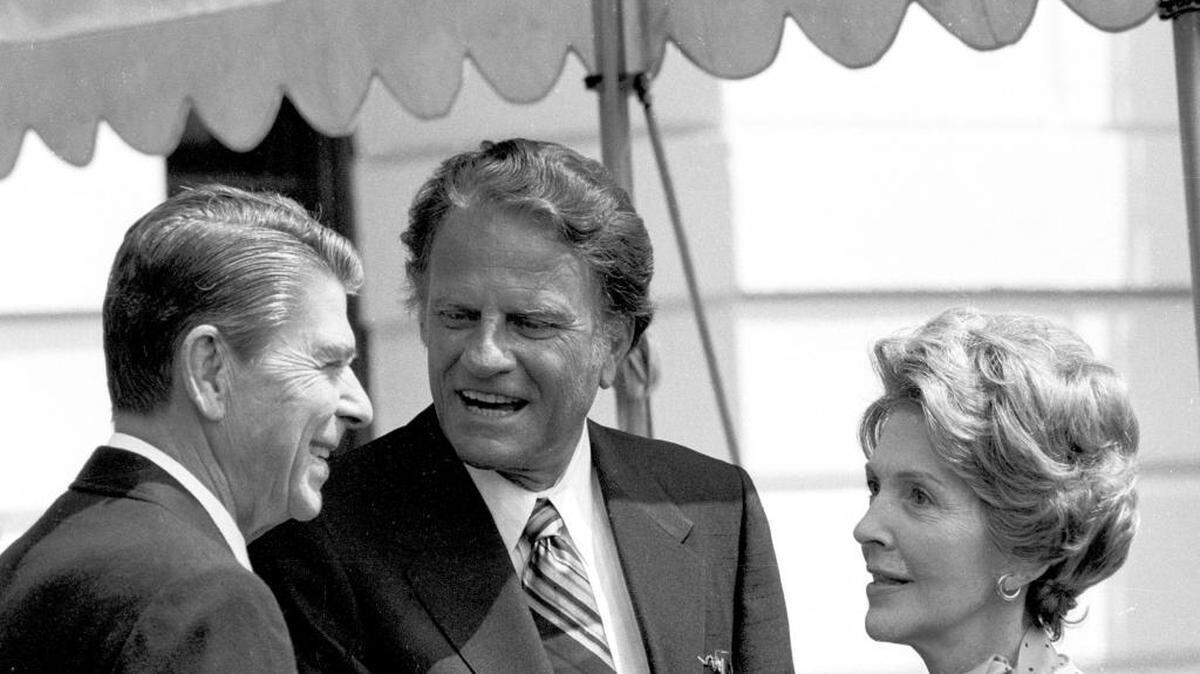 The Rev. Billy Graham, center, talks with President Ronald Reagan, left, and first lady Nancy Reagan at the White House July 18, 1981. Nancy Reagan died Sunday, March 6, 2016, at her home in the Bel-Air section of Los Angeles of congestive heart failure. “One of Nancy’s most wonderful qualities was her steadfast and loyal support for her husband,” Graham said in a statement released Sunday.