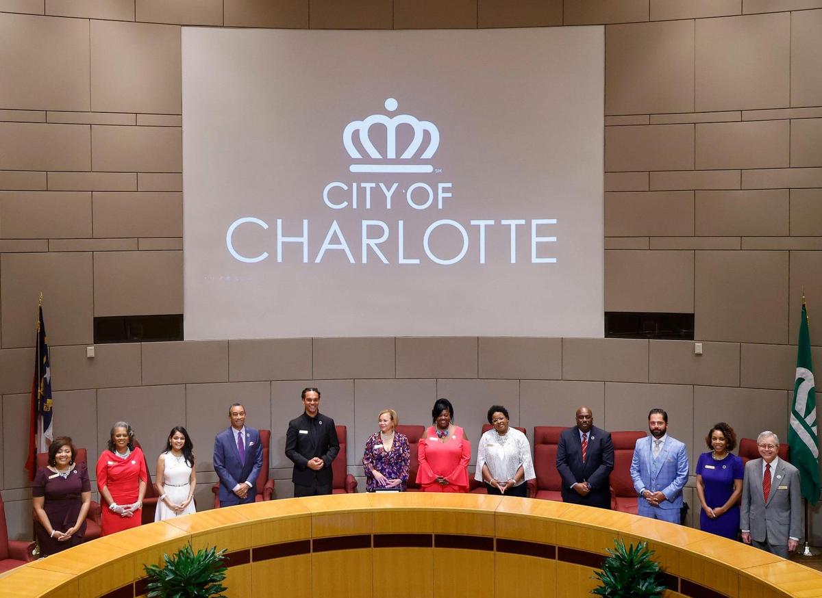 The Charlotte City Council stands after swearing in at the Charlotte-Mecklenburg Government Center in Charlotte, N.C., Tuesday, Sept. 6, 2022.