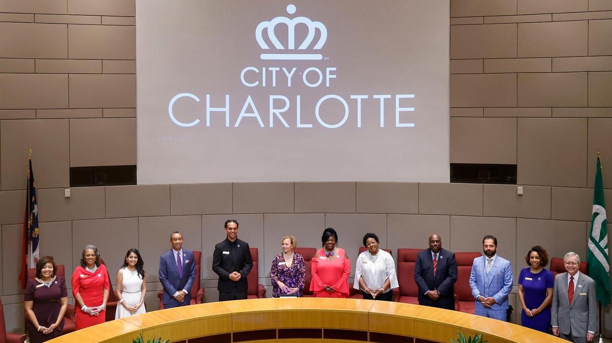 The Charlotte City Council stands after swearing in at the Charlotte-Mecklenburg Government Center in Charlotte, N.C., Tuesday, Sept. 6, 2022.