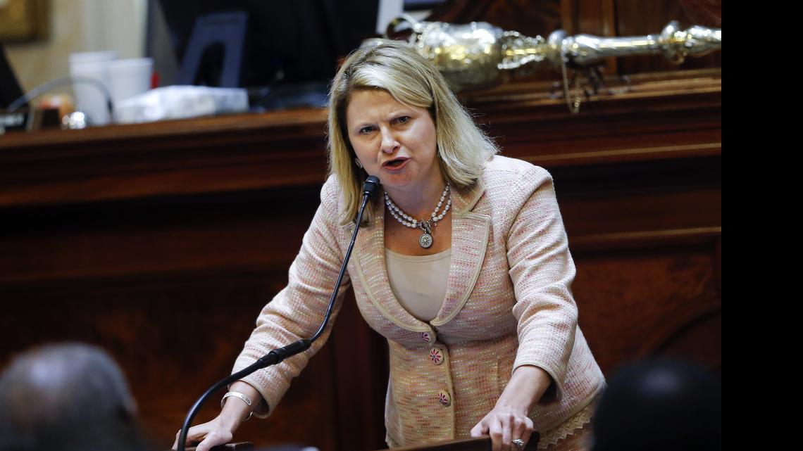 
Rep. Jenny Horne, R-Summerville, gets emotional as she speaks during debate over a Senate bill calling for the Confederate flag to be removed from the Capitol grounds Wednesday, July 8, 2015, in Columbia, S.C. The House is under pressure to act after the state Senate passed its own measure, which is supported by Gov. Nikki Haley. But some Republicans proposed changes to the Senate bill that would preserve some kind of symbol in front of the Statehouse to honor their Southern ancestors. 
