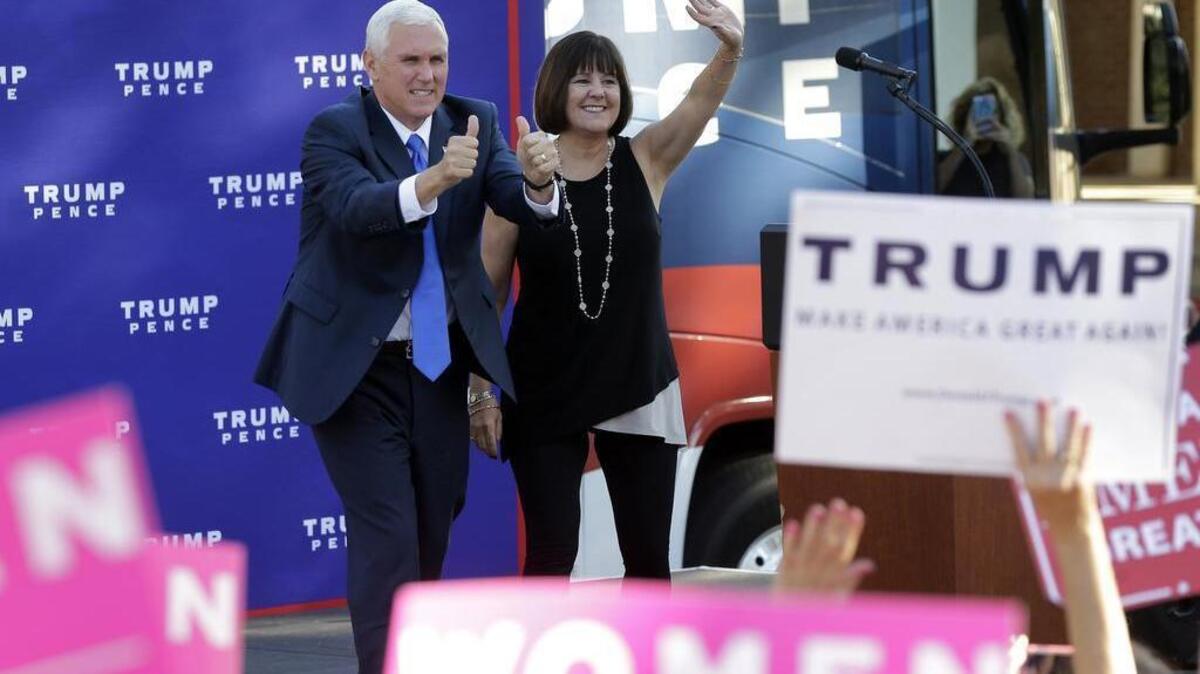 Republican vice presidential candidate, Indiana Gov. Mike Pence, left, and his wife Karen, right, greet supporters as they arrive at a campaign event at Catawba College in Salisbury, N.C., Monday, Oct. 24, 2016.