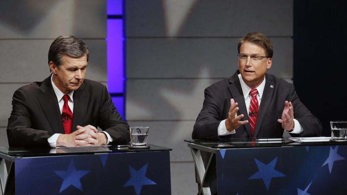 Candidates for governor of North Carolina, from left, Democrat Roy Cooper and Republican Gov. Pat McCrory, debate at WRAL studios in Raleigh, N.C., on Tuesday, Oct. 18, 2016.
