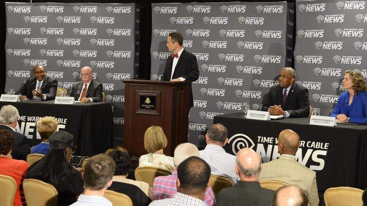 
Mayoral candidates from left,council member Michael Barnes, Mayor Dan Clodfelter, TWC News Charlotte political anchor Tim Boyum,the moderator, council member David Howard, former Mecklenburg County commissioner Jennifer Roberts during the Mayoral debate held at Ballantyne Hotel on August 25,2015.
